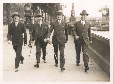 four men walking