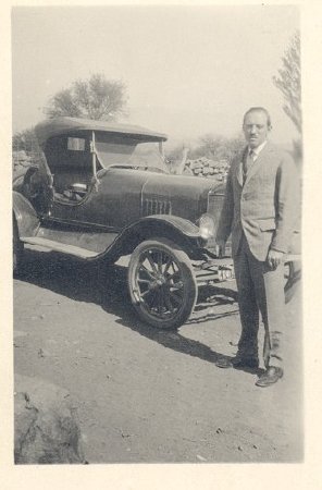 man in front of car