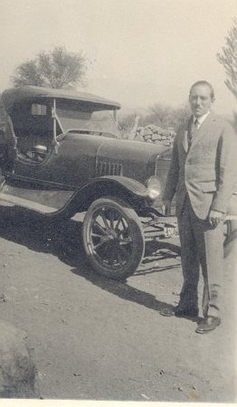 men standing in front of car