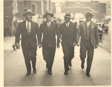 4 men walking