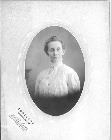 Oval photo of older woman.